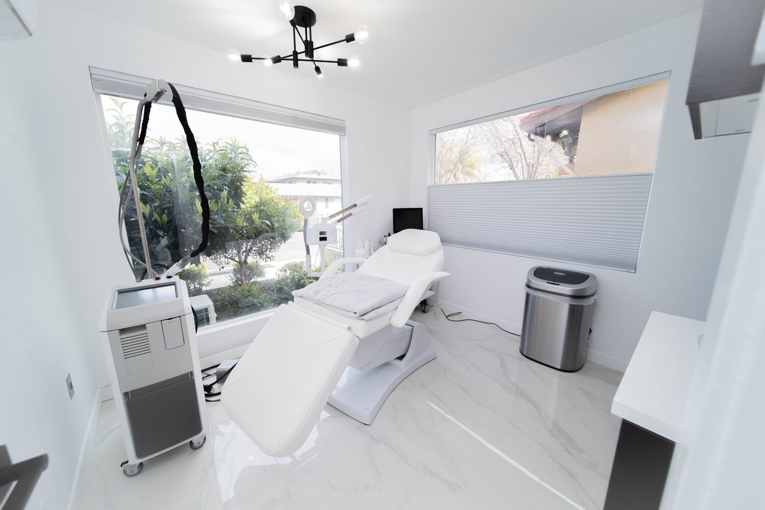 Modern medical treatment room with large windows