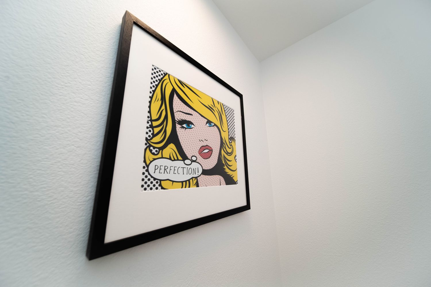 Framed pop art portrait with the word "Perfection"