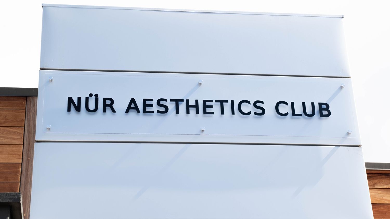 Sign for NÜR Aesthetics Club.