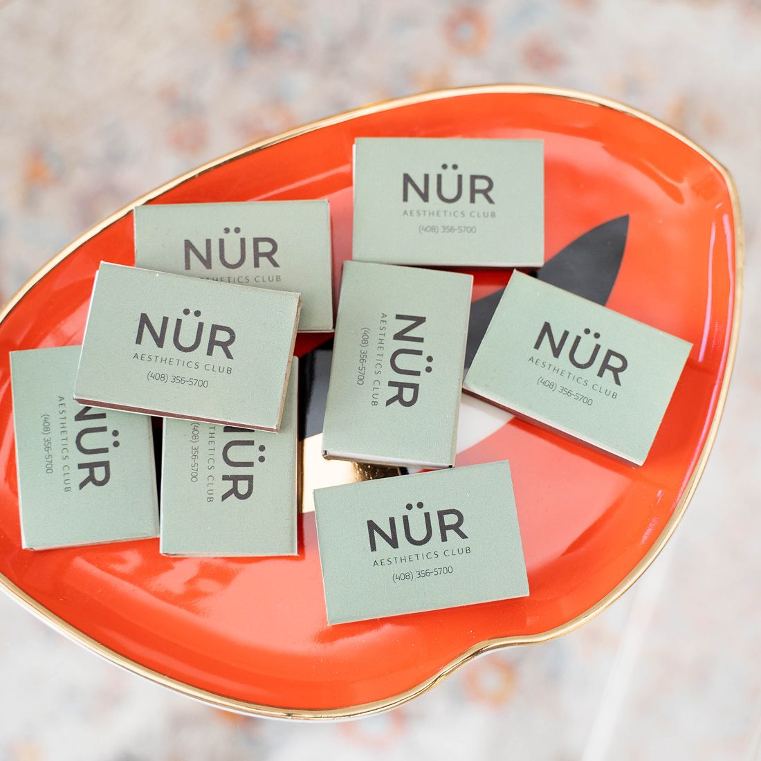 Business cards on a decorative plate.