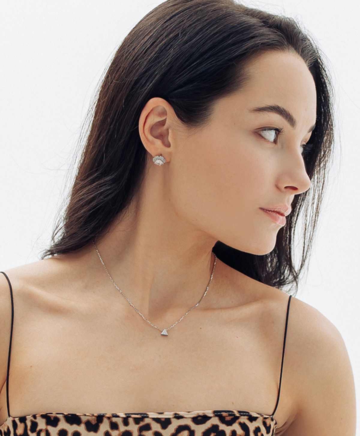 Young lip filler model with long brown hair and blue eyes.