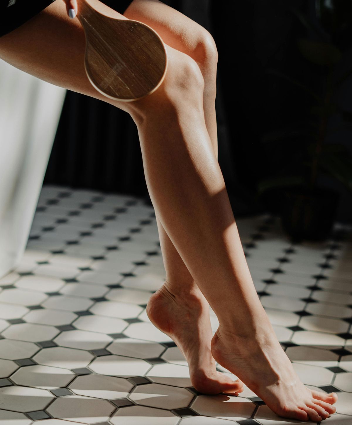 Laser hair removal model with long brown hair and blue eyes.