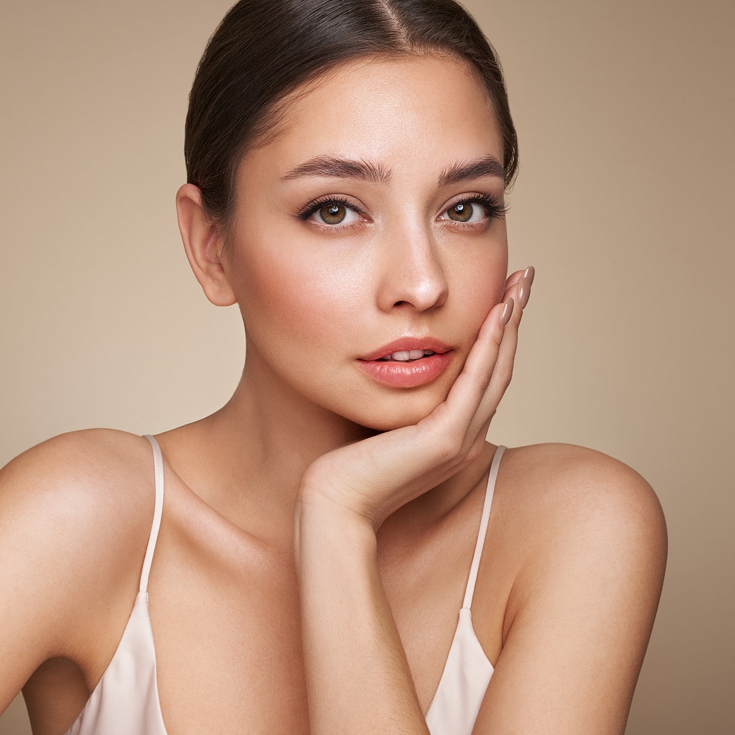 Woman with natural makeup and soft expression.