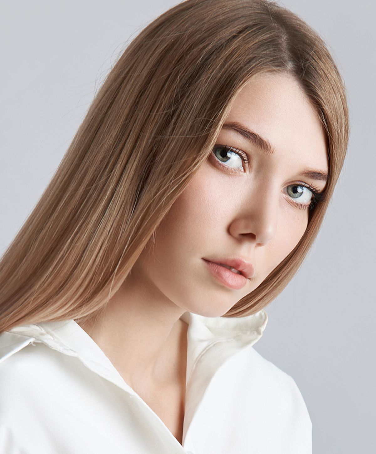 Close-up of woman with curly hair.