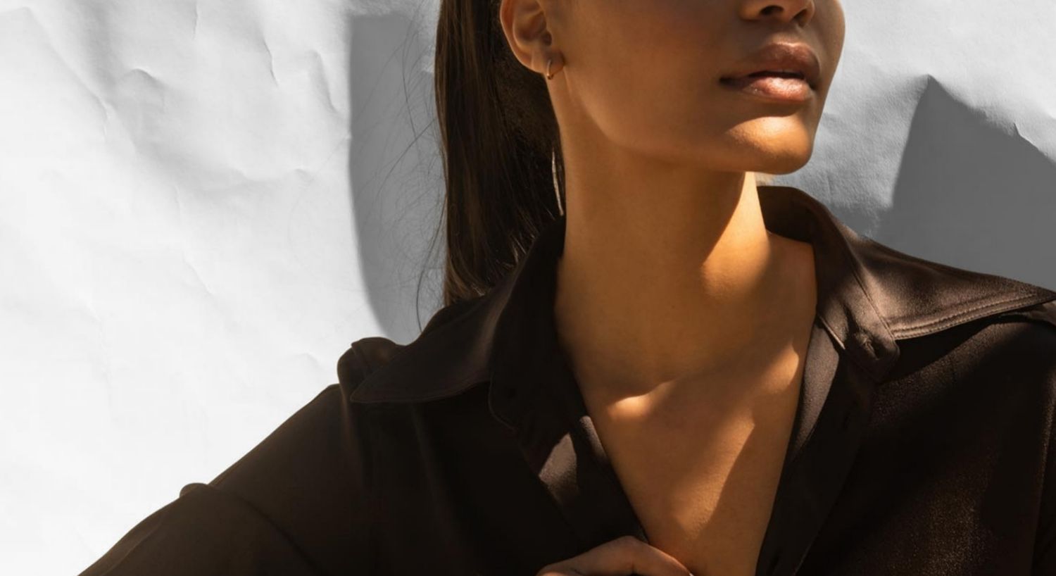 Portrait of a PRP treatment model with curly hair.